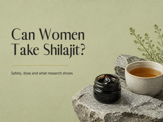 Can Women Take Shilajit? A jar of Shilajit resin beside a cup of tea on a stone